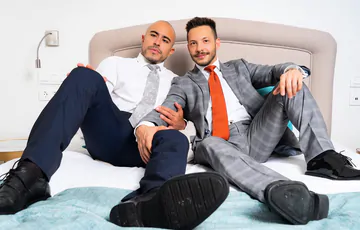 Clothed guys fucking in the shower